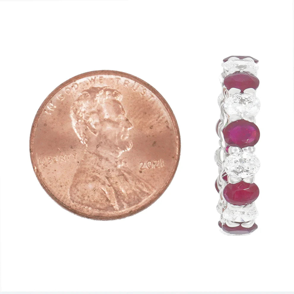 Lovelyn 4.44 Carat Oval Cut Diamond & Ruby Eternity Ring Size Comparison to a coin