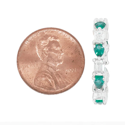 Lidwina 2.46 Carat Emerald Cut Diamond & Pear Cut Emerald Eternity Ring Size comparison to a coin