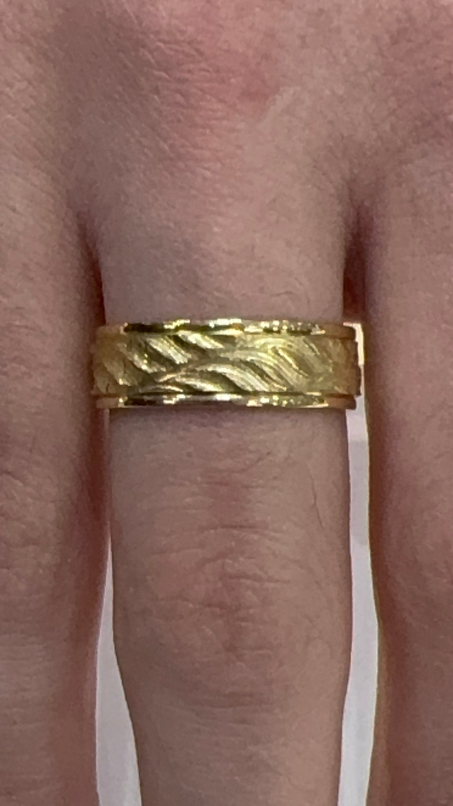 18 karat gold Wave Ring Wedding Band  shown as worn on the finger 