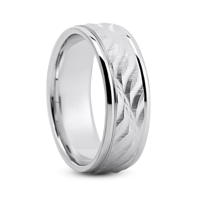 White gold men’s wedding band with carved leaf design in the center in high polished border 7 mm shown on a white background