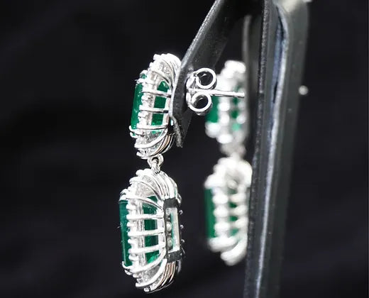 Adelaide 20.11 Carats Emerald Cut Emerald Gemstone Dangle Earrings in 18K White Gold side view