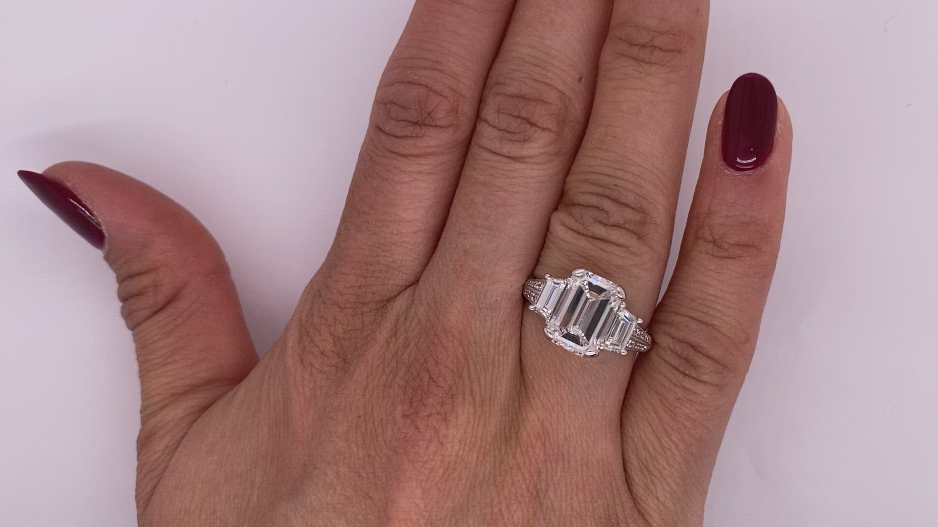 Diamond Ring Emerald Cut 4 Carat Three Stone in Platinum Video on Hand